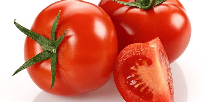 Three ripe red tomatoes on a white background—two whole and one cut to reveal the juicy interior.